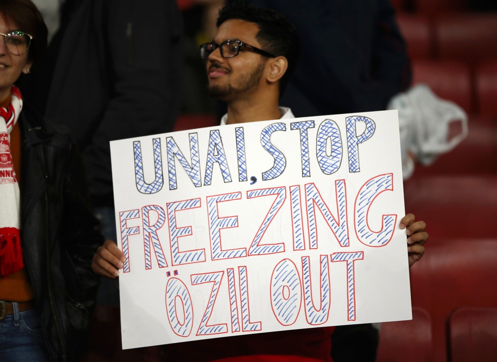 Another sign was in support of Mesut Ozil, who was left out of the matchday squad once again