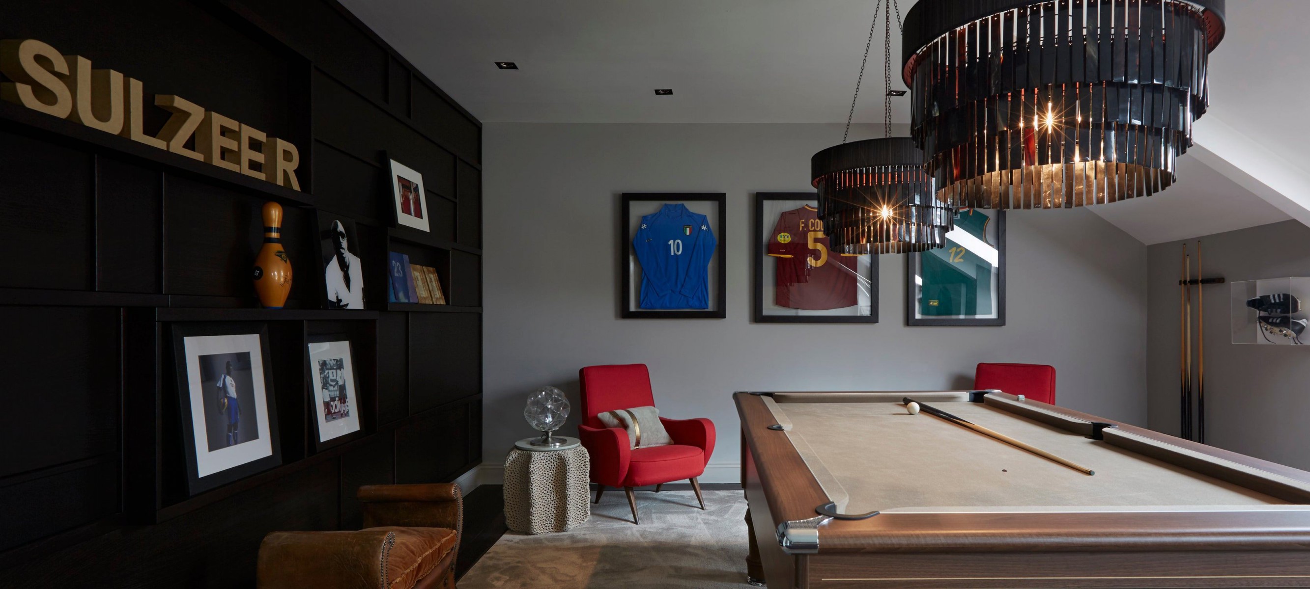 Dotted around the house are framed football shirts