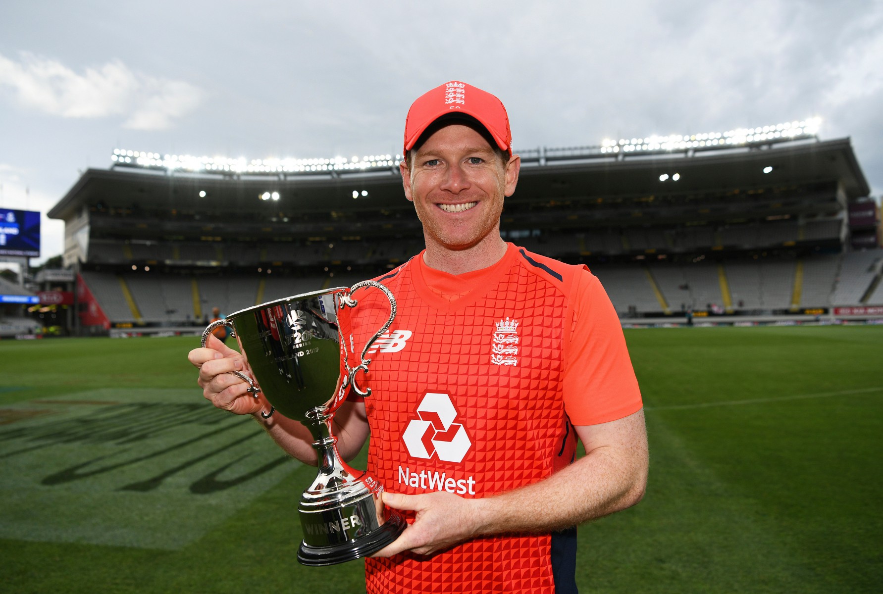 Morgan poses with the T20 series trophy after wrapping up a 3-2 victory for the tourists
