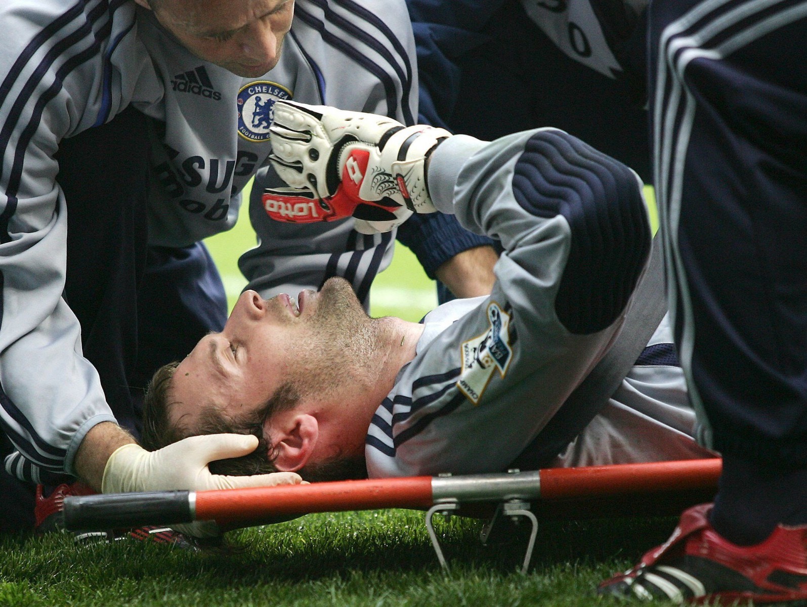 Petr Cech is carried off on a stretcher after fracturing his skull