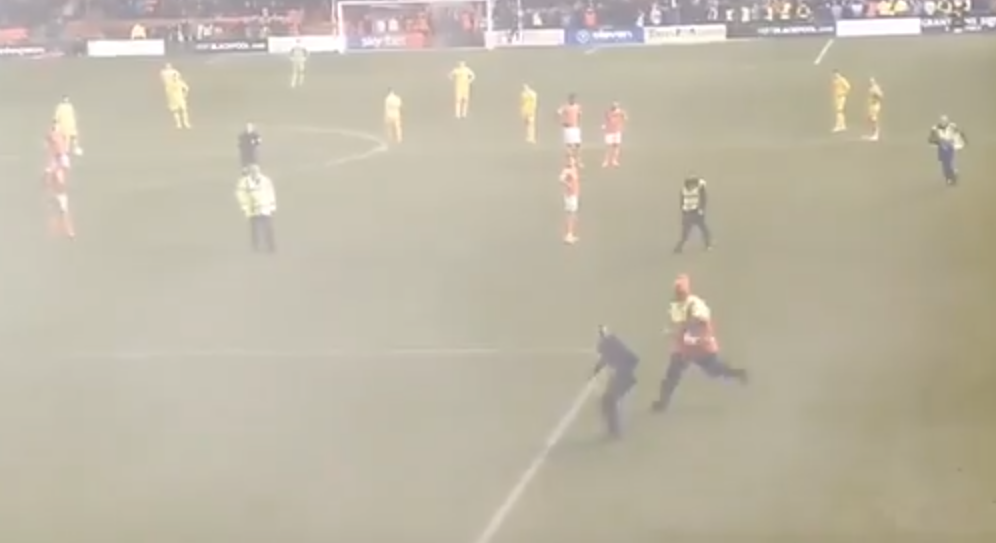 The chaos started when a Fleetwood fan ran on to the pitch at Blackpool yesterday