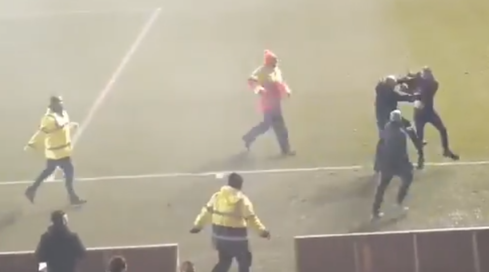 After escaping the stewards, the fan was finally downed by two home supporters