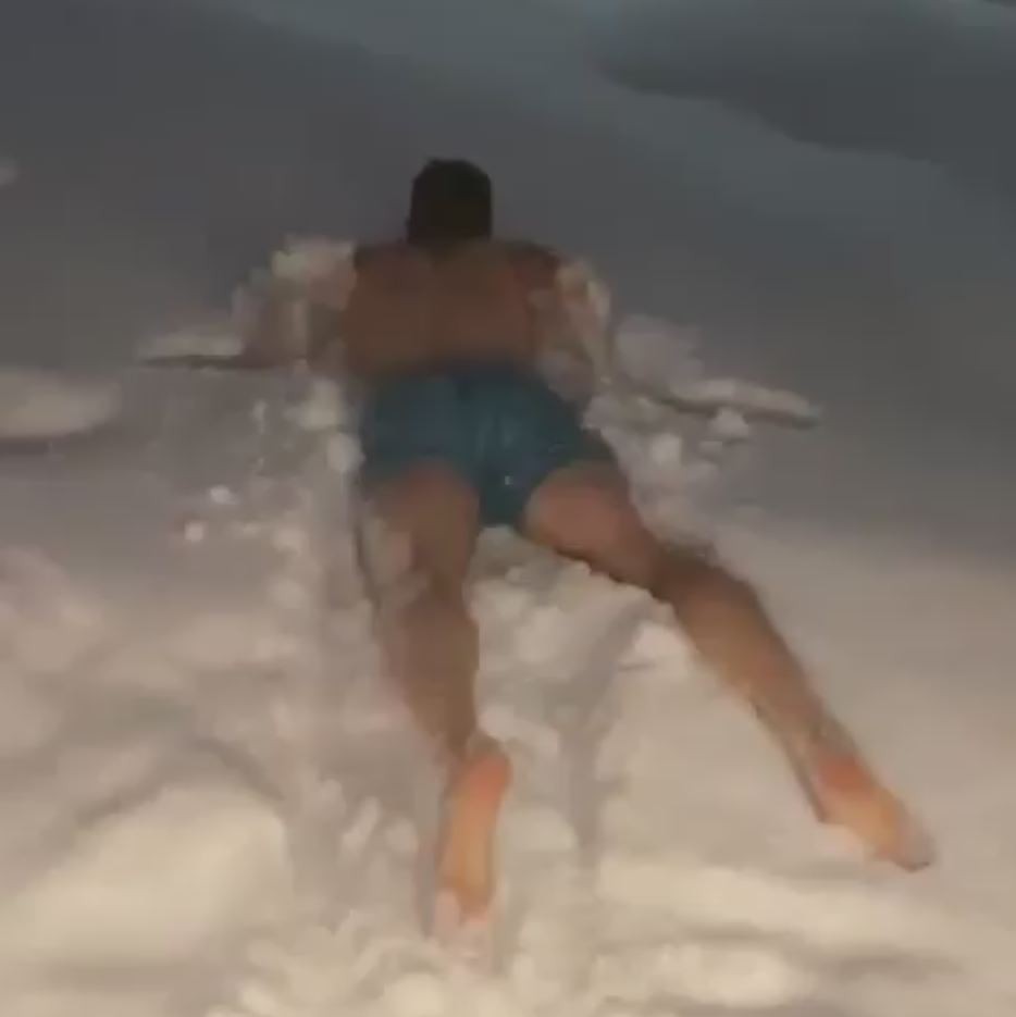 , Watch Spurs star Harry Kane dive face first into a snow drift wearing only his shorts on trip to Santas home in Finland
