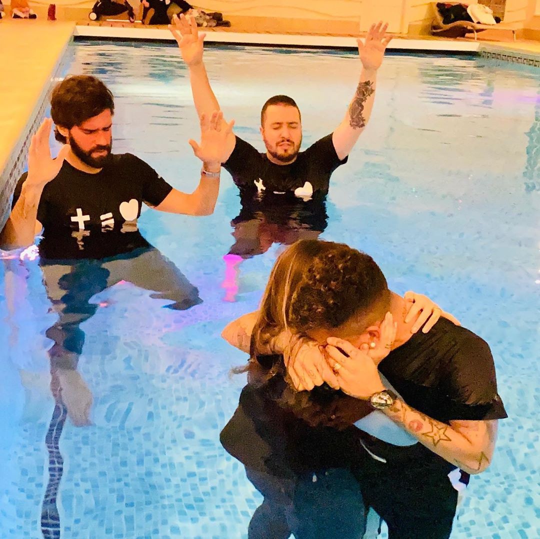 Alisson prayed for Firmino in the swimming pool while the forward embraced his wife Larissa