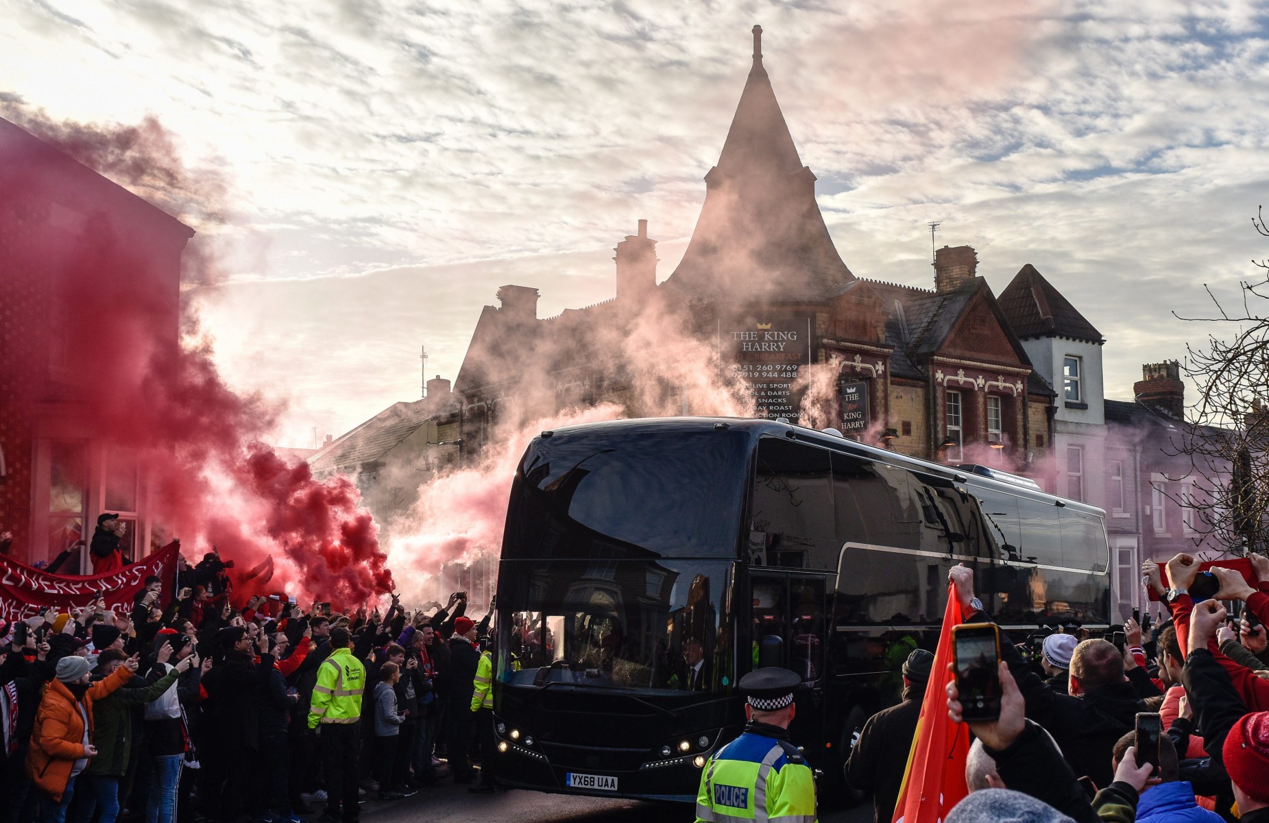 , Man Utd team bus surrounded by Liverpool fans who welcome rivals to Anfield with hostile reception and smoke grenades