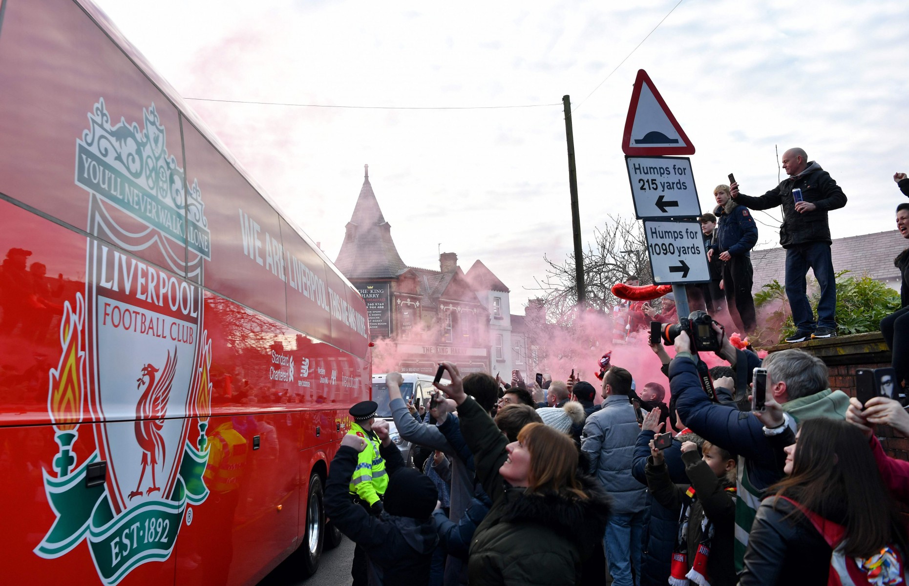 , Man Utd team bus surrounded by Liverpool fans who welcome rivals to Anfield with hostile reception and smoke grenades