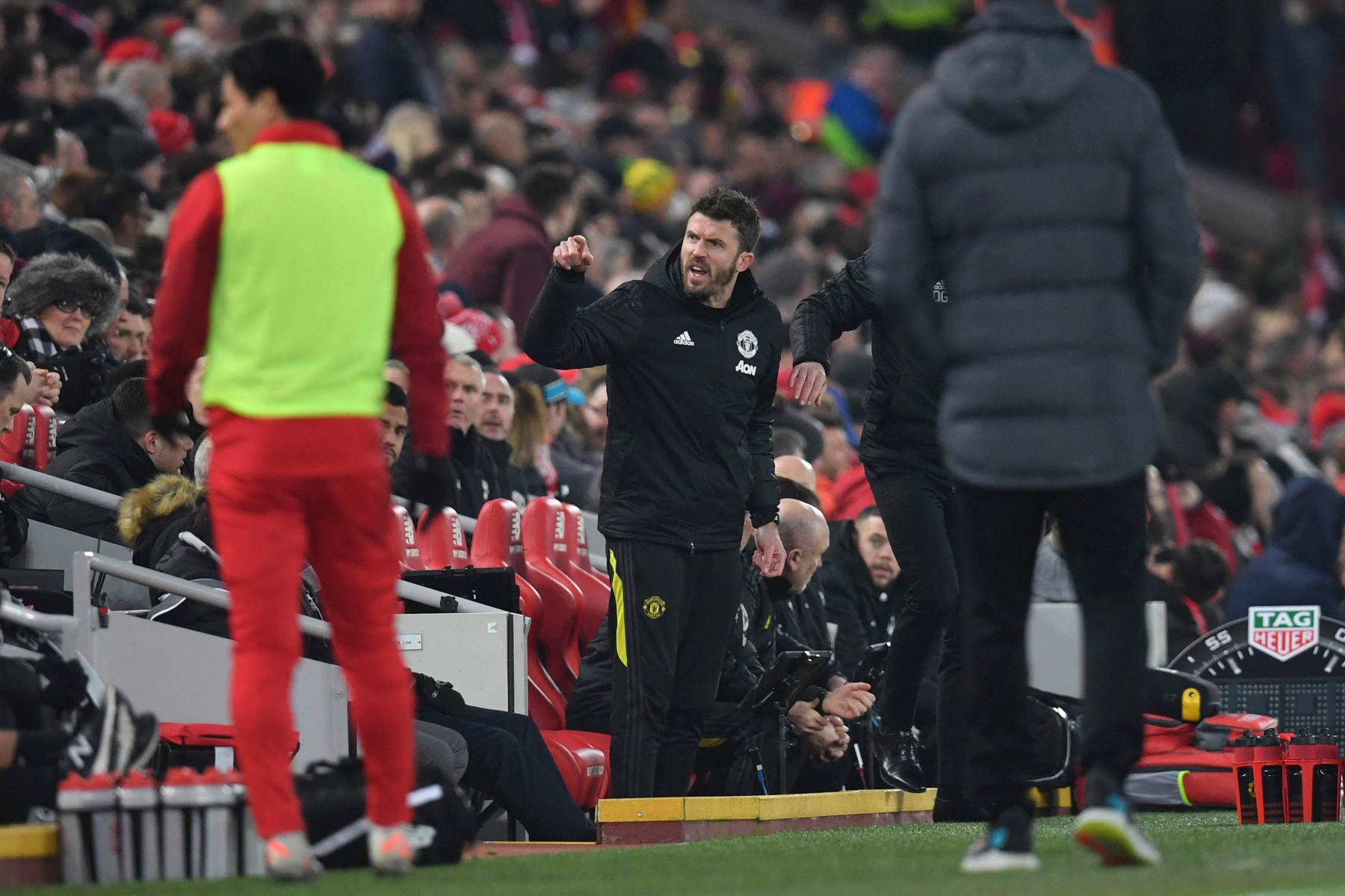 , Furious Michael Carrick clashes with Liverpool fans at Anfield after moaning at referee from the Man Utd bench