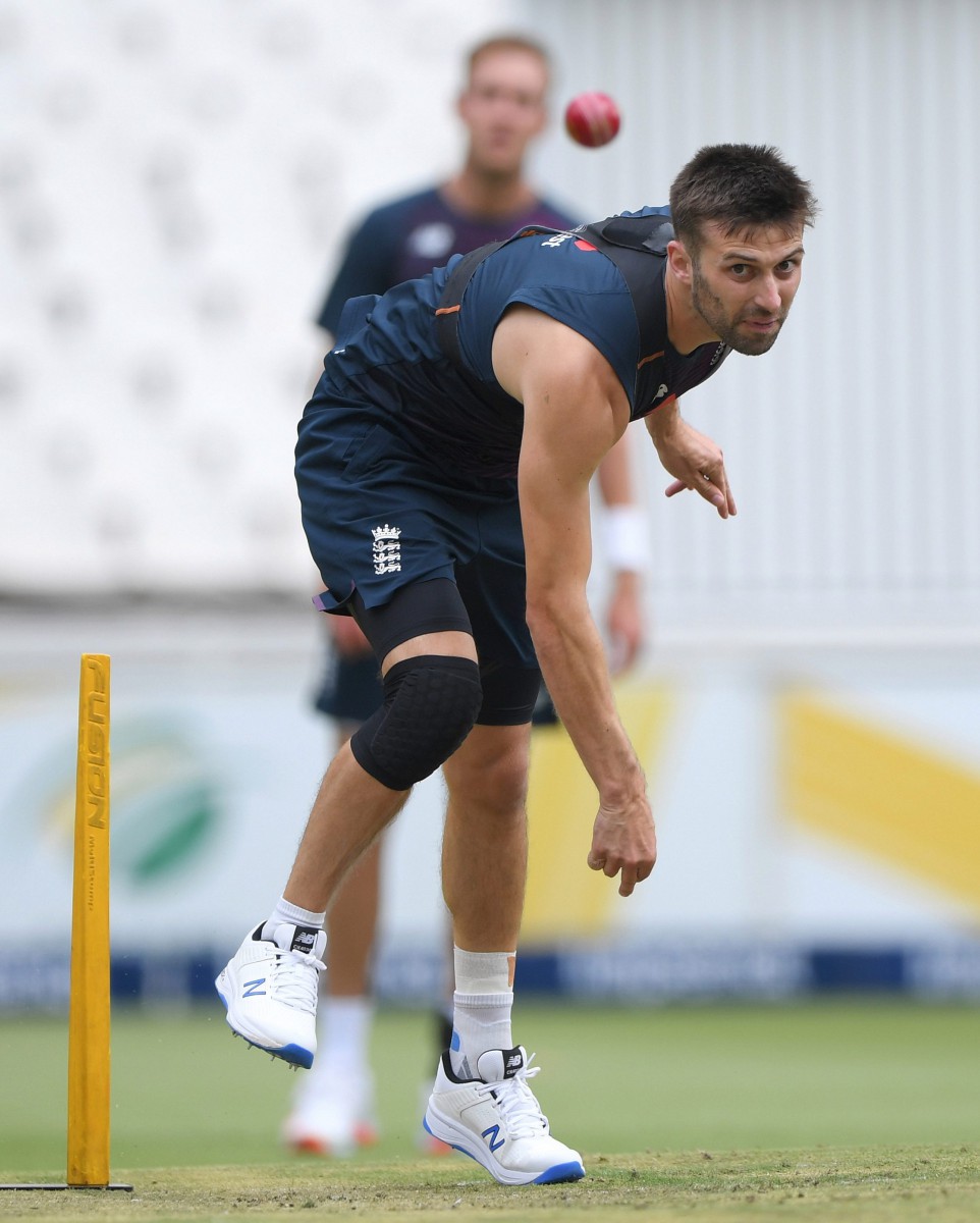 Stuart Broad watches on as Mark Wood goes through his paces in bowling practice