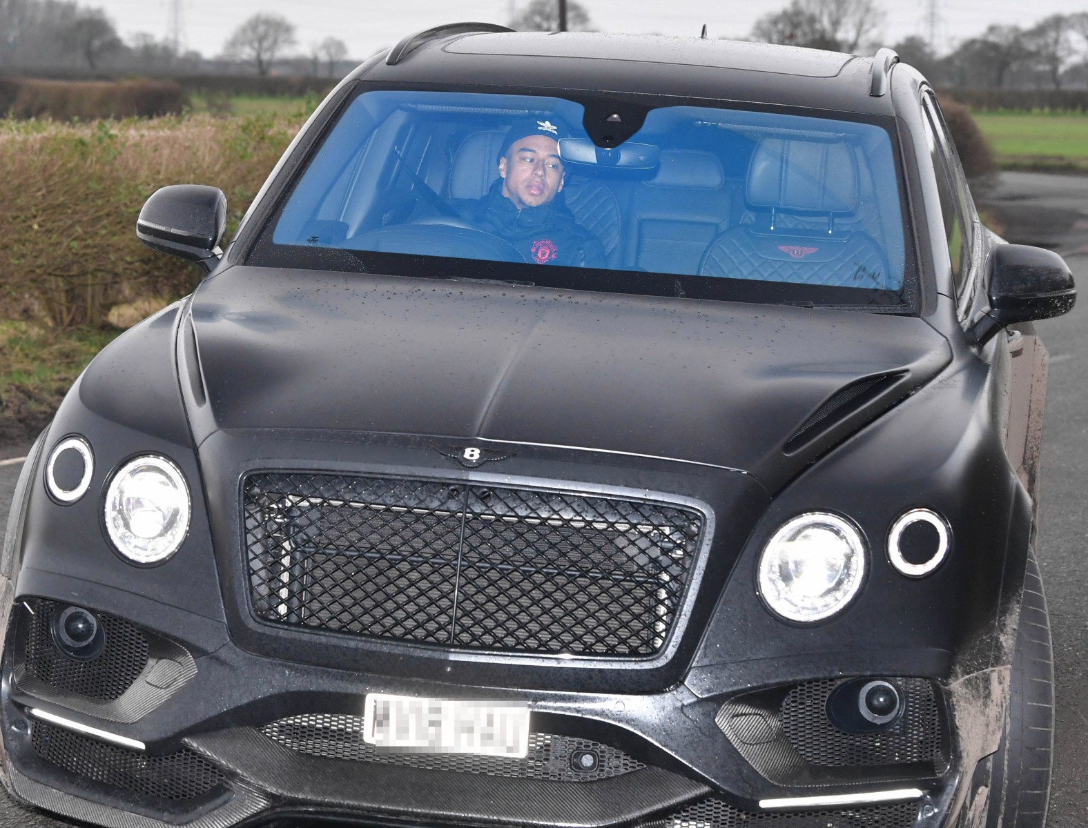 Jesse Lingard in his Bentley driving into training