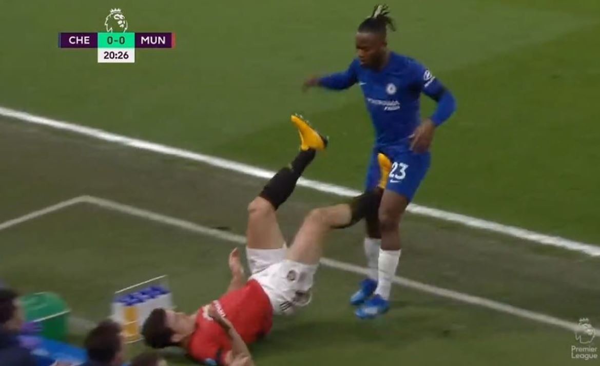 Harry Maguire got away with this apparent kick out at Michy Batshauyi in the first half