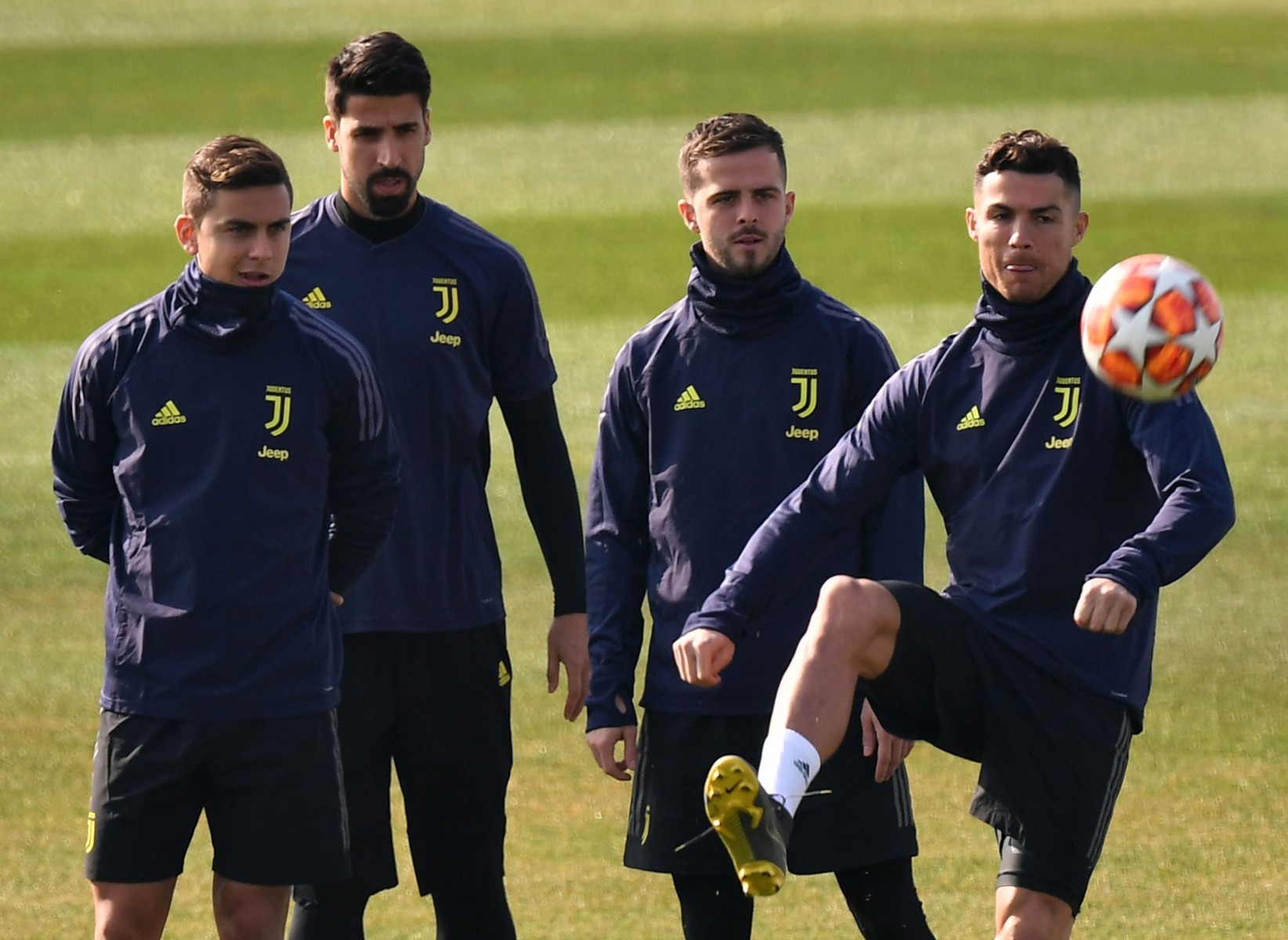 Paulo Dybala, left, and Cristiano ronaldo flank Juventus team-mates Sami Khedira and Miralem Pjanic - who have both left virus-hit Turin for other countries