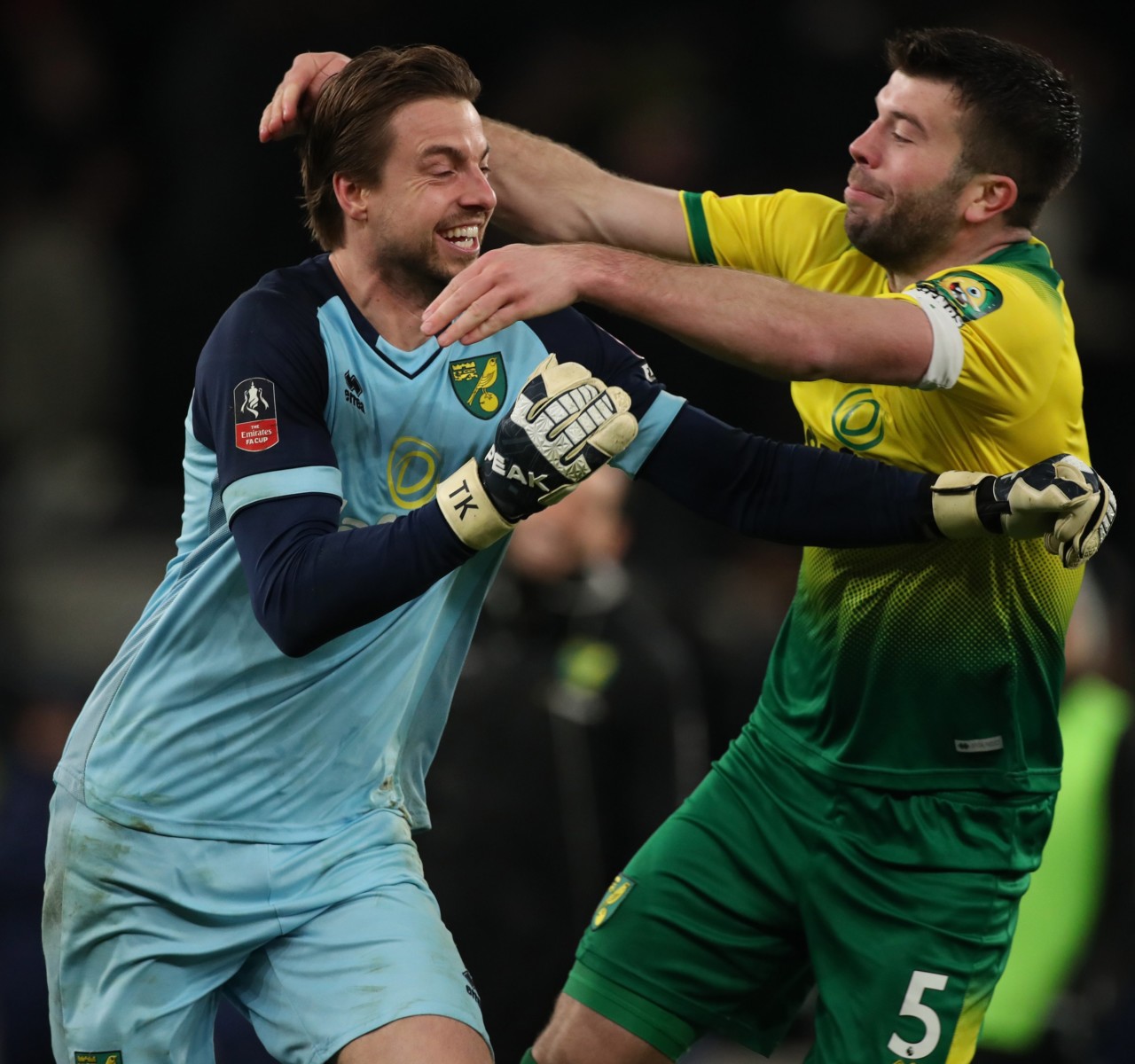 Tim Krul celebrates his crucial penalty from Gelson Fernandes with Norwich team-mate Grant Hanley