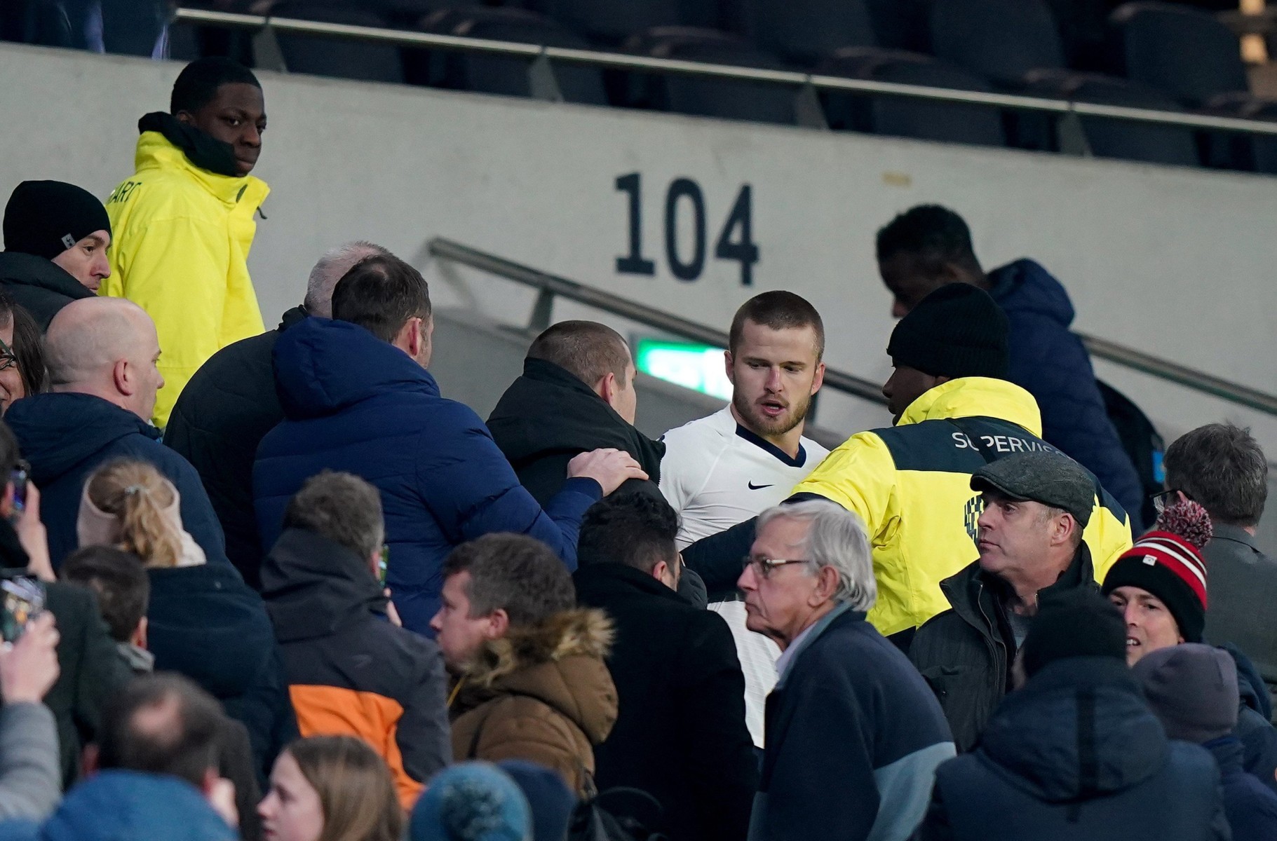 Fans and stewards are said to have intervened to calm the situation down after Eric Dier was caught in a verbal clash with a supporter