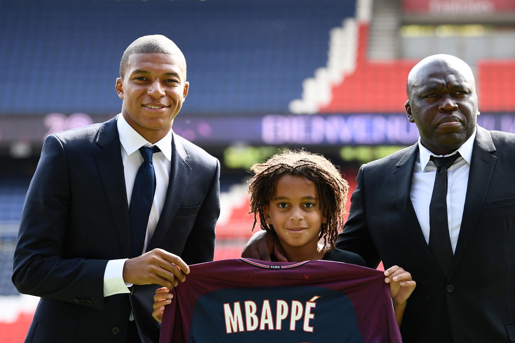 The PSG striker, pictured with his brother Ethan and dad Wilfried, is thought to be the world's most valuable player