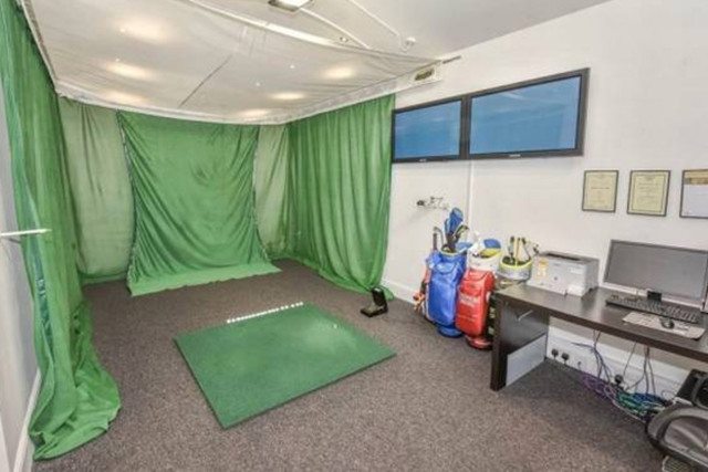 McIlroy's father Gerry converted the garage to be a golfing studio