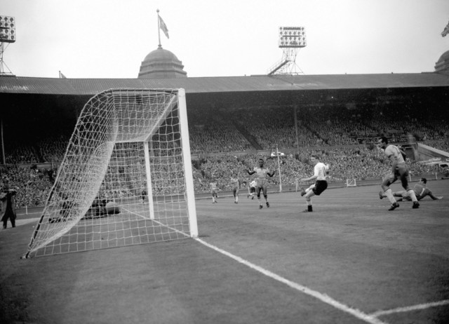 Colin Grainger (white shirt) scores England's fourth goal (and his second) of the game from a header during the friendly against Brazil at Wembley in 1956