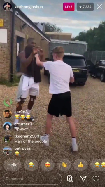 , Anthony Joshua spars local lads in car park after training as smiling heavyweight champ winds down