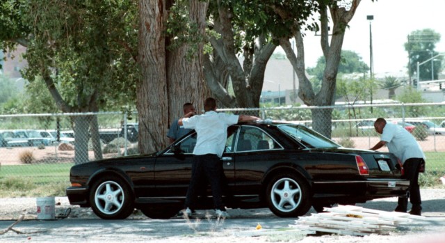 Tyson arrives for training in his Bentley Continental T in 1997