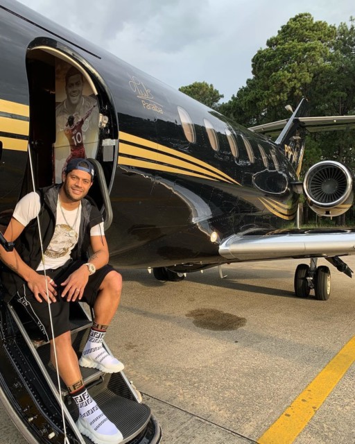Hulk stands outside his private jet, which of course bears the striker's signature on the outside