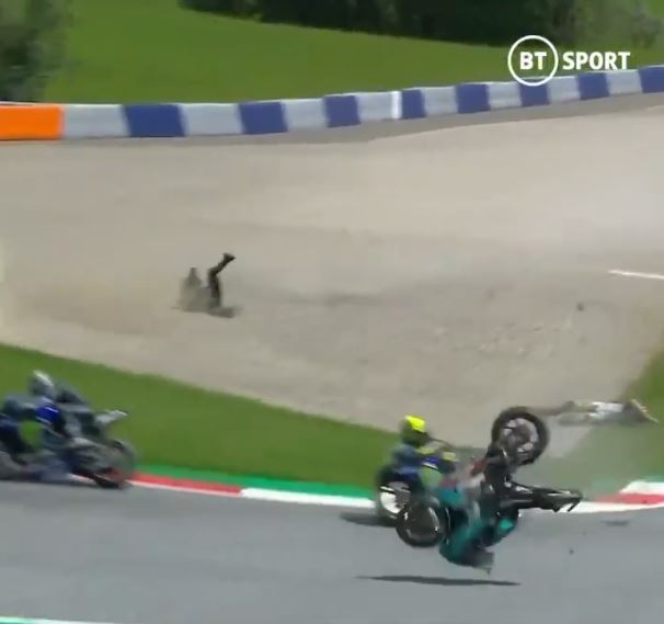 , Watch 200mph horror crash as MotoGP riders collide at Austrian GP and flying bikes miss Rossi by a whisker
