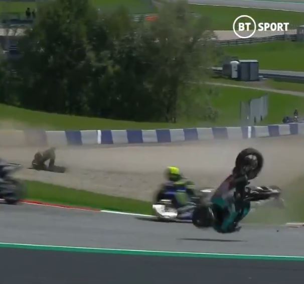 , Watch 200mph horror crash as MotoGP riders collide at Austrian GP and flying bikes miss Rossi by a whisker