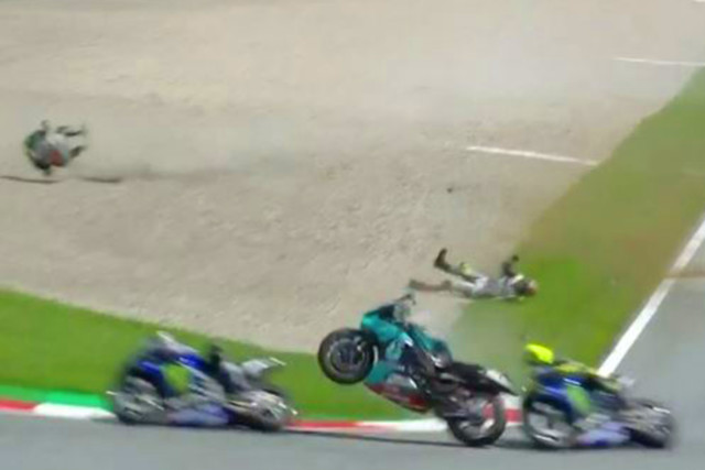 , Watch 200mph horror crash as MotoGP riders collide at Austrian GP and flying bikes miss Valentino Rossi by a whisker