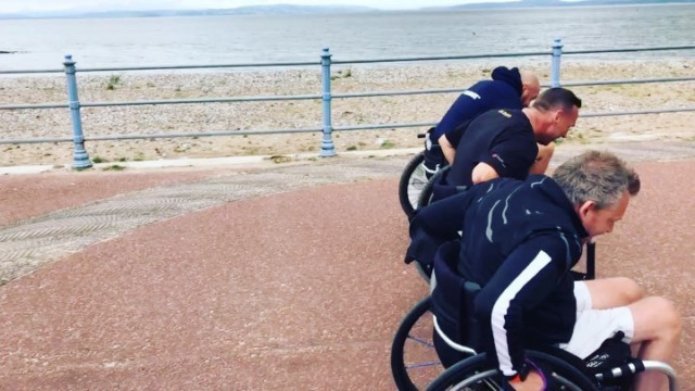 , Tyson Fury joins gruelling seven-mile wheelchair race along Morecambe Bay 36 hours after sparring for fans with dad John