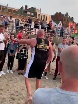 , Watch Tyson Fury train on beach in preparation for Deontay Wilder and entertain crowd by singing American Pie