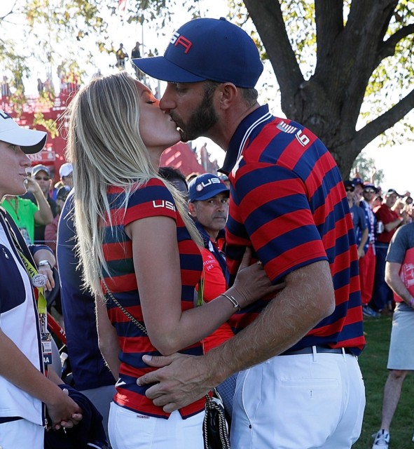 Paulina Gretzky kisses fiance Dustin Johnson for good luck during the Ryder Cup last year