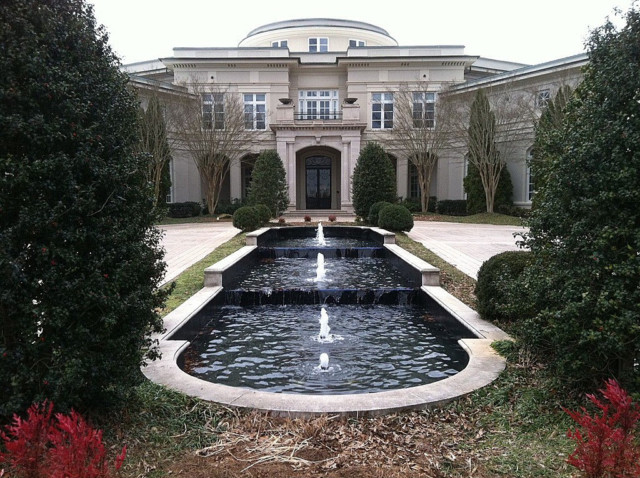 , Inside Evander Holyfield’s 109-room Georgia mansion with bowling alley, theatre and pool he sold to Rick Ross for £4.7m
