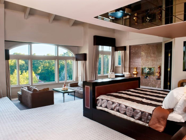 The master bedroom offers incredible views of the gardens