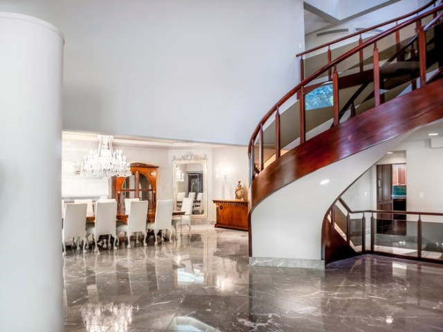 The ground floor features marble floors