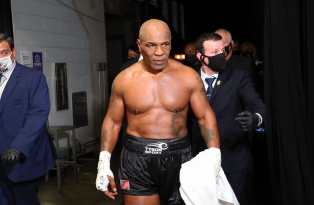, Mike Tyson hits back at Floyd Mayweather over boxing world title criticism and says more belts means extra money