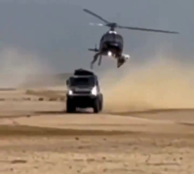, Watch heart-stopping moment low-flying helicopter tears roof off Dakar Rally race truck in botched filming scene