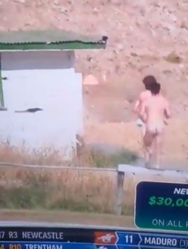 , Two NAKED people caught on camera running next to racetrack leave fans absolutely stunned