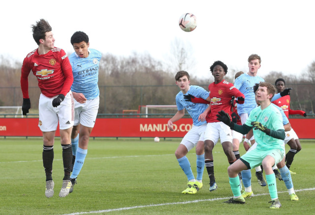 , Watch Man Utd starlet Charlie McNeill score four goals in derby against old club City and celebrate by kissing the badge