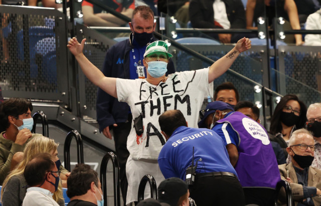 , Australian Open final marred by fan protest halting play and crowd booing when Covid vaccine is mentioned in ceremony