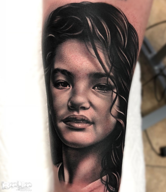 Alvarez has his daughter's image tattoed on his arm