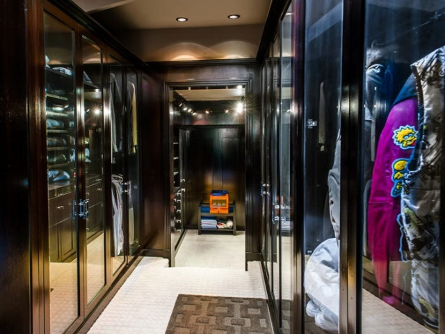 The walk-in closets are glass fronted