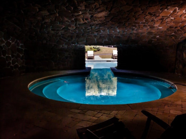 The outdoor pool features its own grotto