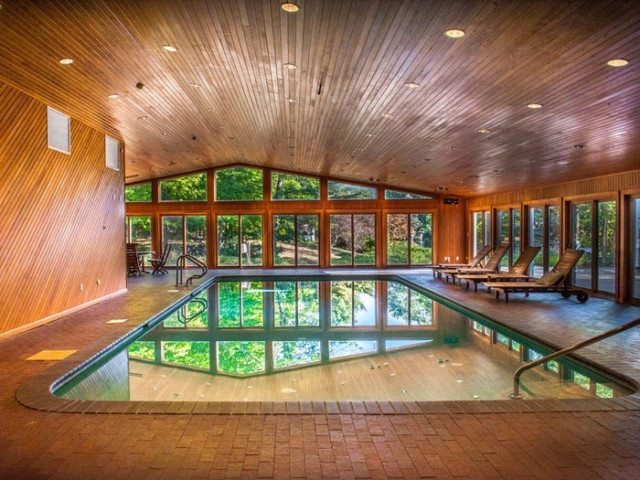 The indoor swimming pool is one of two at the home
