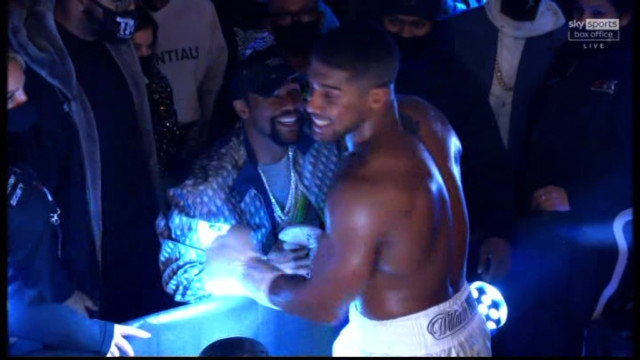AJ celebrates the win with boxing royalty Mayweather 