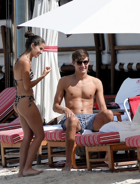 , F1 star George Russell cuddles and kisses stunning girlfriend Carmen Montero Mundt on beach in St Barts