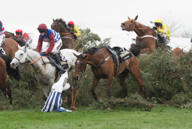 , Amazing Grand National photos show extent of world’s most fearsome race where even jockeys hide for cover under fences