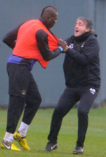 Roberto Mancini had to drag Mario Balotelli off the training pitch after a nasty tackle on Scott Sinclair