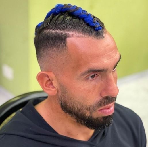 , Carlos Tevez shows off daring new haircut with blue braided mohawk in dramatic new look from old long locks
