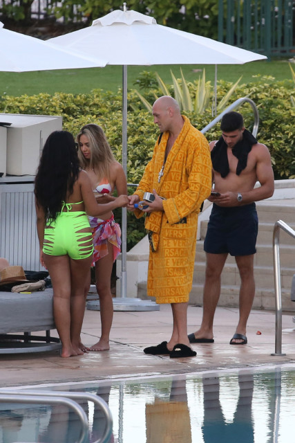 , Tyson Fury laps up the female attention as his brother Tommy looks on during break from training in Miami