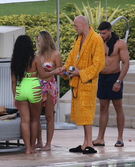 , Tyson Fury laps up the female attention as his brother Tommy looks on during break from training in Miami