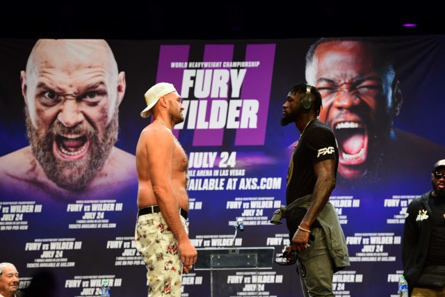 , Deontay Wilder recites poem to topless Tyson Fury and vows to ‘cut off his head’ before wearing headphones to snub Brit