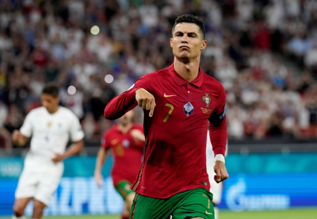 , Cristiano Ronaldo has Coca-Cola bottle thrown at him before Euro 2020 stewards protect Portugal star from pitch invader
